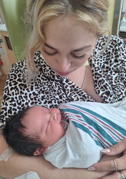 Casen and his mom snuggle together at CHRISTUS Children's