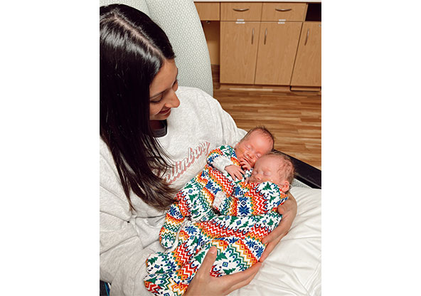 New mom Destiny holds her new twin girls, Cambrie and Scout