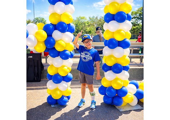 Maddox smiles and stands for a picture after recovering from Cavernous Angioma