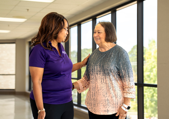 Susan Duke with a CHRISTUS Health employee