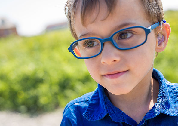 A little boy with his cochlear implant