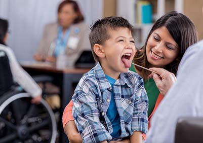 Young boy getting a throat culture in urgent carae
